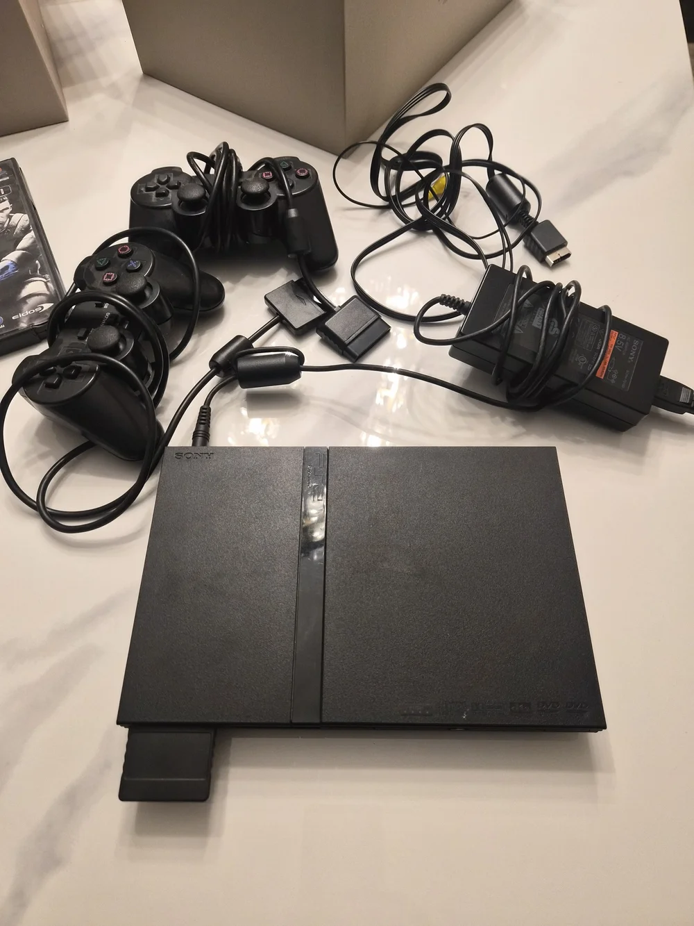Sony Black PlayStation 2 Slim System with DualShock Controllers and Cables